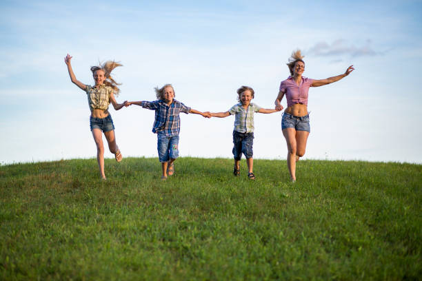 istock Mother and children running 935058932