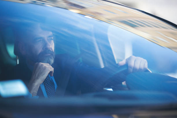istock Senior businessman driving his car 935059400