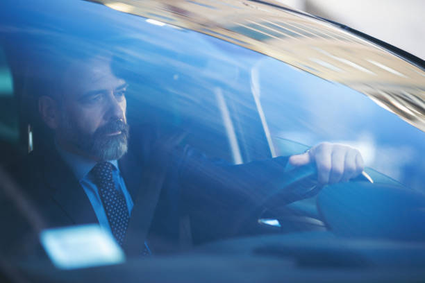 istock Senior businessman driving his car 935061750