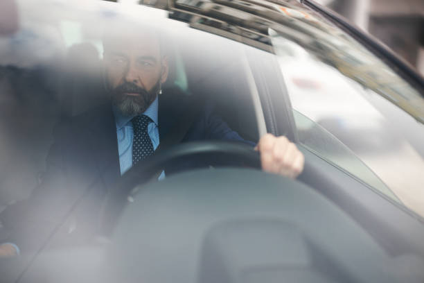 istock Senior businessman driving his car 935062504