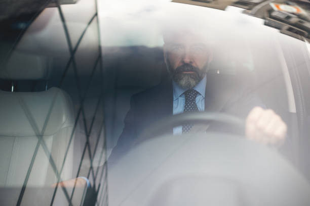 istock Senior businessman driving his car 935062600