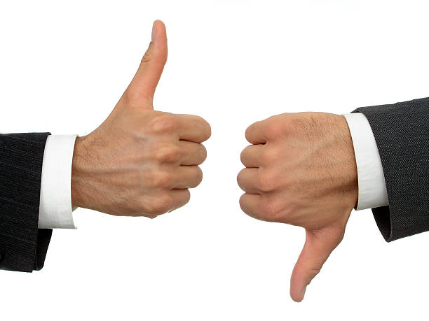 istock Businessmen's hands, thumbs-up, thumbs-down 93506577