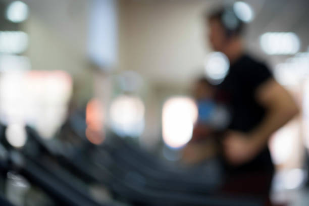 istock Blurred people in gym on treadmills 935071412