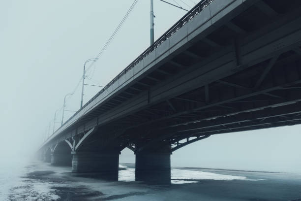 istock Chernavsky bridge in fog in Voronezh, perspective, blue toned 935072218