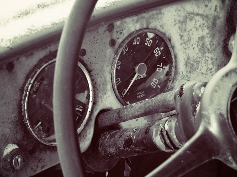 An abandoned vintage vehicle.