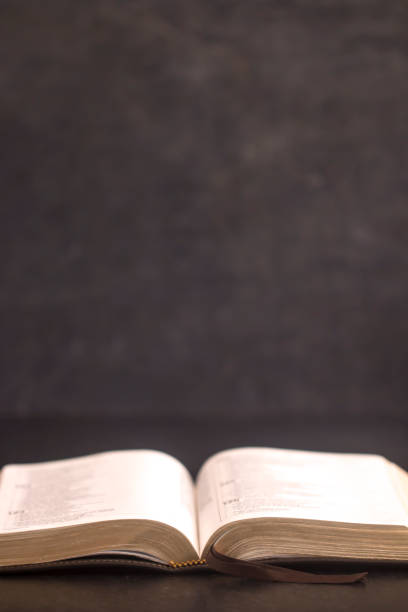Open Bible on a Slate Tabletop with Customizable Space to Add Text