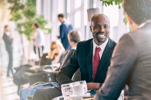istock Two businessmen having coffee at an airport 935088608