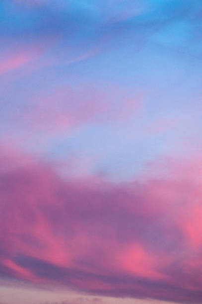 istock The vertical view of sky background or texture at the sunset time with clouds. Copy space 935088834