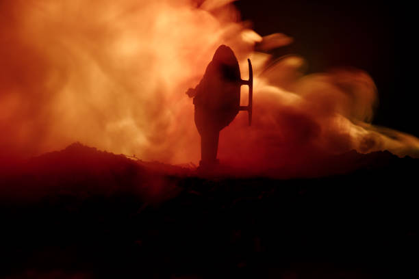 istock Air Crash. Burning falling helicopter. Destroyed helicopter. Decorated with toy at dark fire background. 935091702