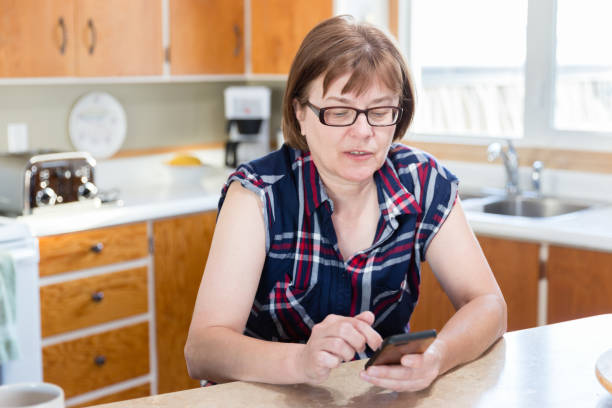 istock close up of woman using her cell phone. 935091878