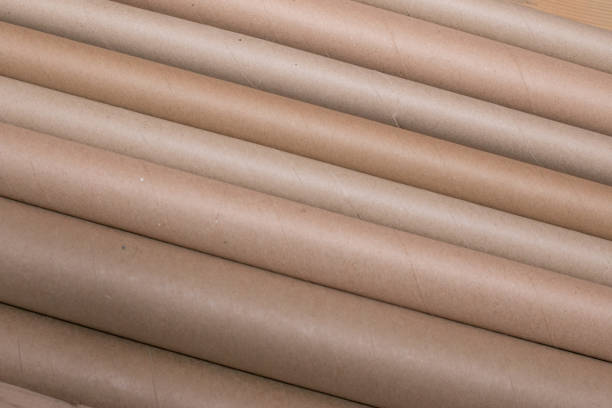 istock Diagonal lines of brown cardboard tubes 935094622