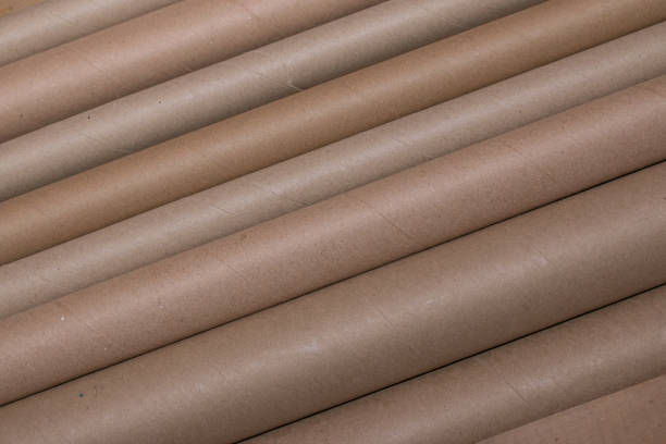 istock Diagonal lines of brown cardboard tubes 935094626