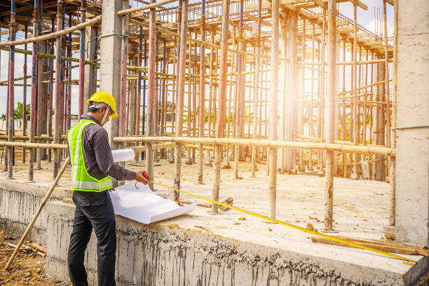 istock Asian business man construction engineer worker at house building site 935110050