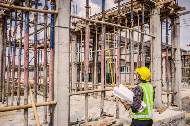 istock Asian business man construction engineer worker at house building site 935110054