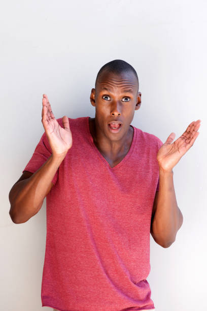 istock african american man with hands raised in confusion 935110278