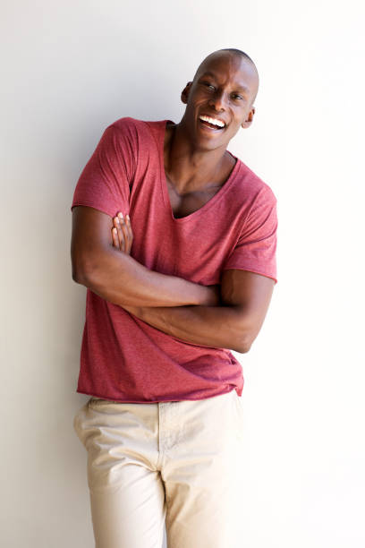 istock cheerful african american man laughing by white background 935110292