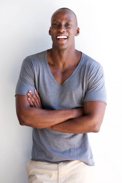 istock confident african american man laughing with arms crossed 935110304