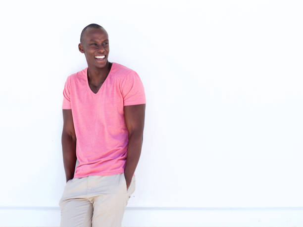 istock cool african american man smiling by white wall 935110324