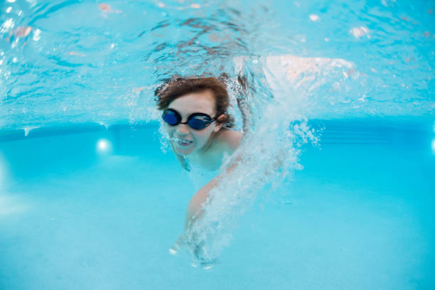 istock Going for gold, child swimming fast 935110578