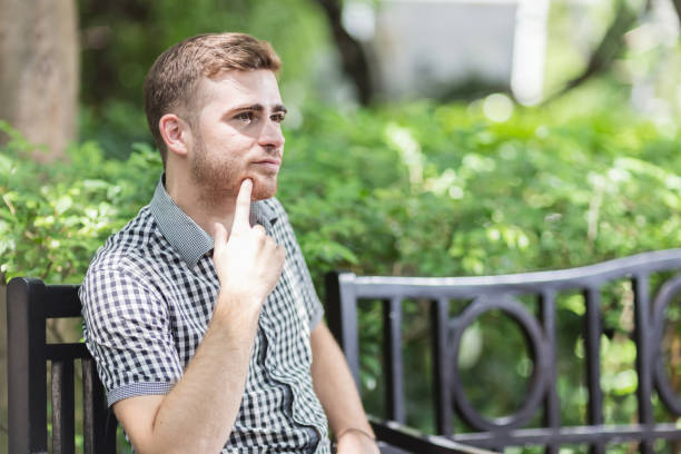 istock white man student happiness smiling in the garden 935110636