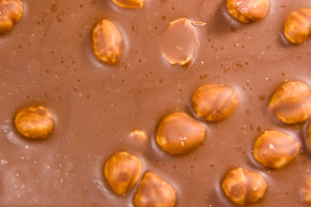 istock Background of the dark chocolate with a hazelnuts 935122862