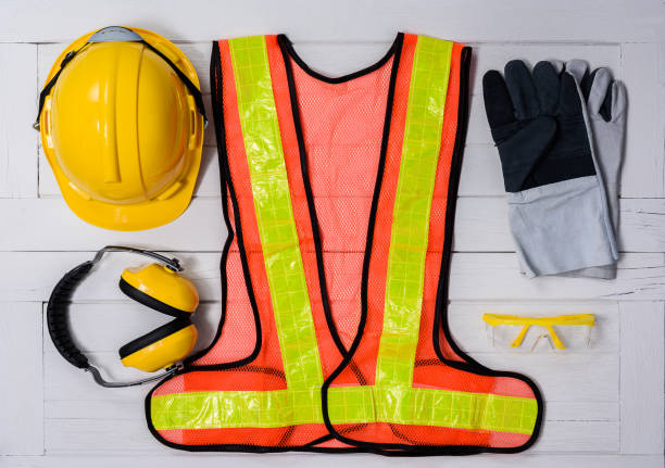 istock Standard construction safety equipment on wooden table. top view 935135972