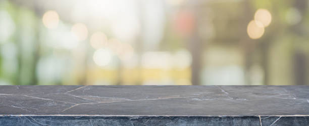 istock Empty black marble Stone table top and blurred restaurant interior banner background - can used for display or montage your products. 935138226