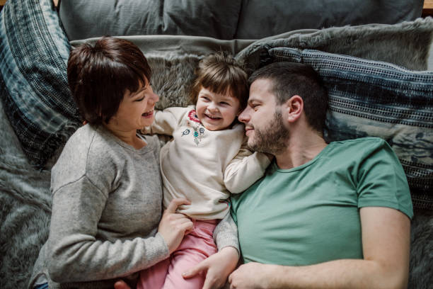 istock Single child family laying in bed 935142404