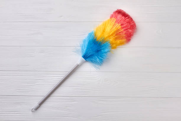 istock Striped fluffy duster on wooden background. 935145302