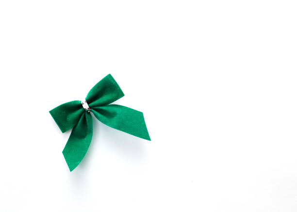 istock single green velvet bow isolated on white 935156004