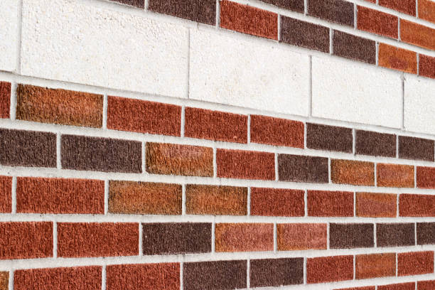 istock Vintage red and brown brick wall background with white brick accent stripe 935164892