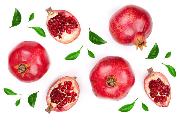istock pomegranate with leaves isolated on white background. Top view. Flat lay pattern 935164978