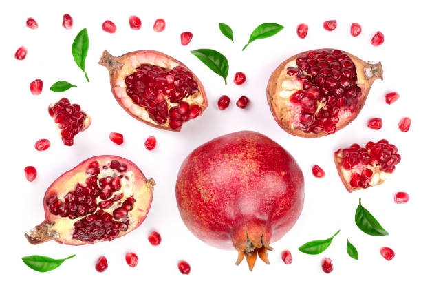 istock pomegranate with leaves isolated on white background. Top view. Flat lay pattern 935165054