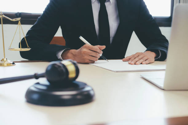 istock Judge gavel with Justice lawyers working at office. 935165382