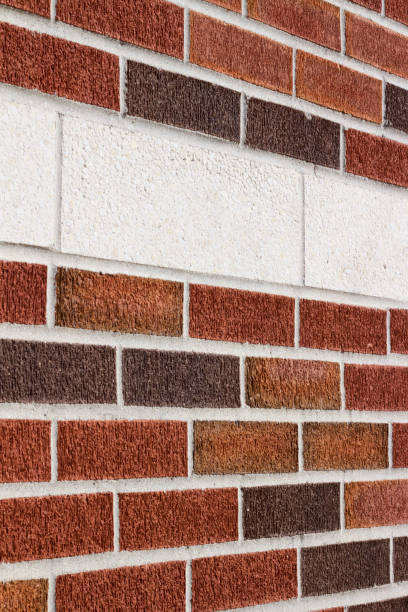 istock Vintage red and brown brick wall background with white brick accent stripe 935167874