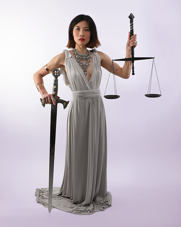 East Asian Lady justice holding scales and sword