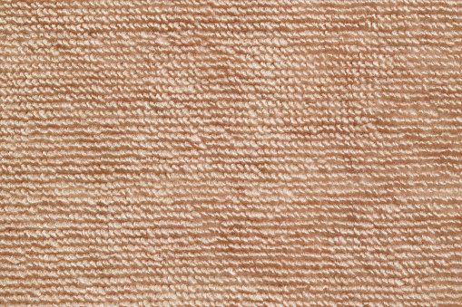 Texture of light brown carpet texture.Close-up of the brown carpet texture background.