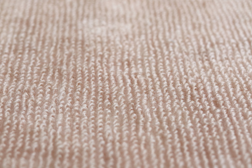 Texture of light brown carpet texture.Close-up of the brown carpet texture background