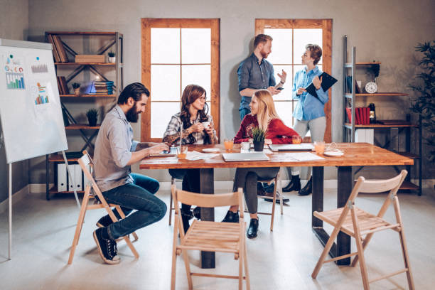 istock Co-workers discussing about new business ideas 935212358