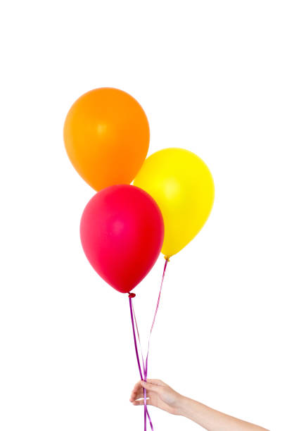 istock Womans hand holds balloons in a white background 935214774