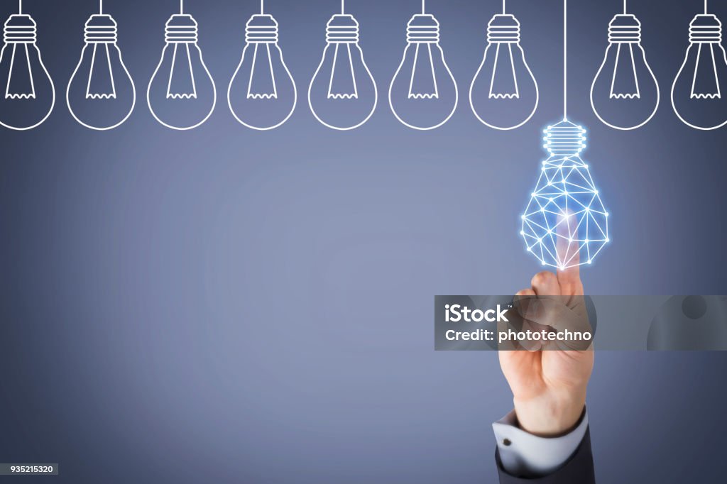 Innovation concept with light bulbs on Touch Screen Intellectual Property Stock Photo