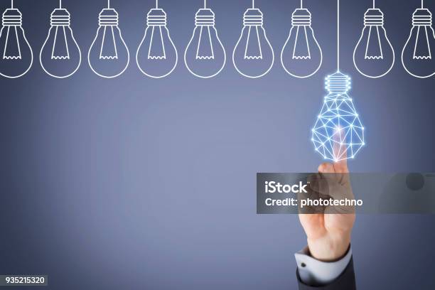 Innovation Concept With Light Bulbs On Touch Screen Stock Photo - Download Image Now