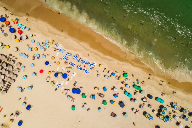istock Top aerial view with ocean and colorful umbrellas 935220270