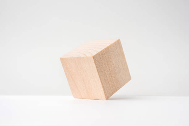 istock abstract geometric real wooden cube with surreal layout on white floor 935220928