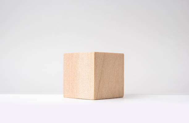 abstract geometric real wooden cube with surreal layout on white floor