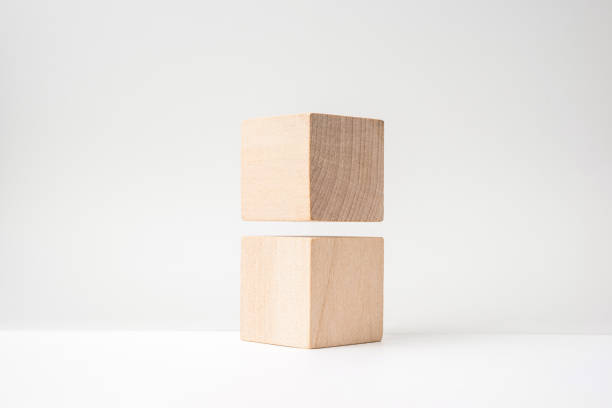 istock abstract geometric real wooden cube with surreal layout on white floor 935223254