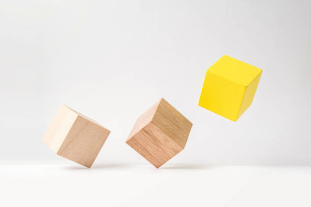 istock abstract geometric real wooden cube with surreal layout on white floor background 935223316