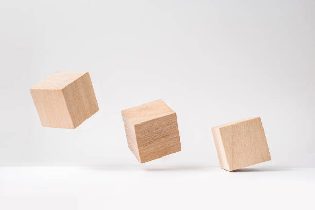 istock abstract geometric real wooden cube with surreal layout on white floor background 935223368