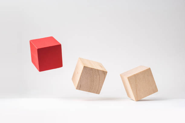 istock abstract geometric real wooden cube with surreal layout on white floor background 935223390