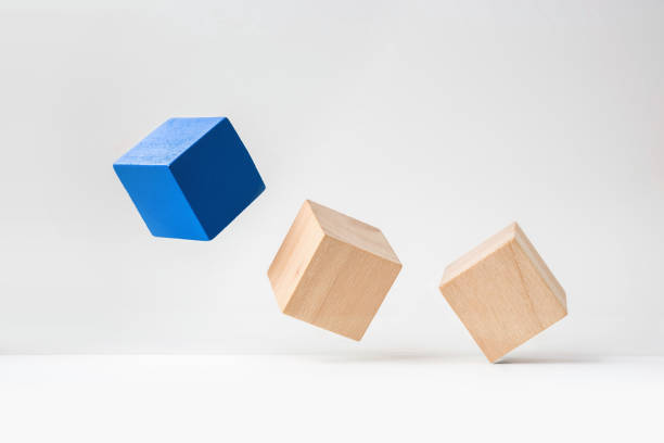 istock abstract geometric real wooden cube with surreal layout on white floor background 935223416